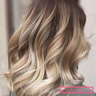 Stile elegante e alla moda su capelli medi con grandi ricci